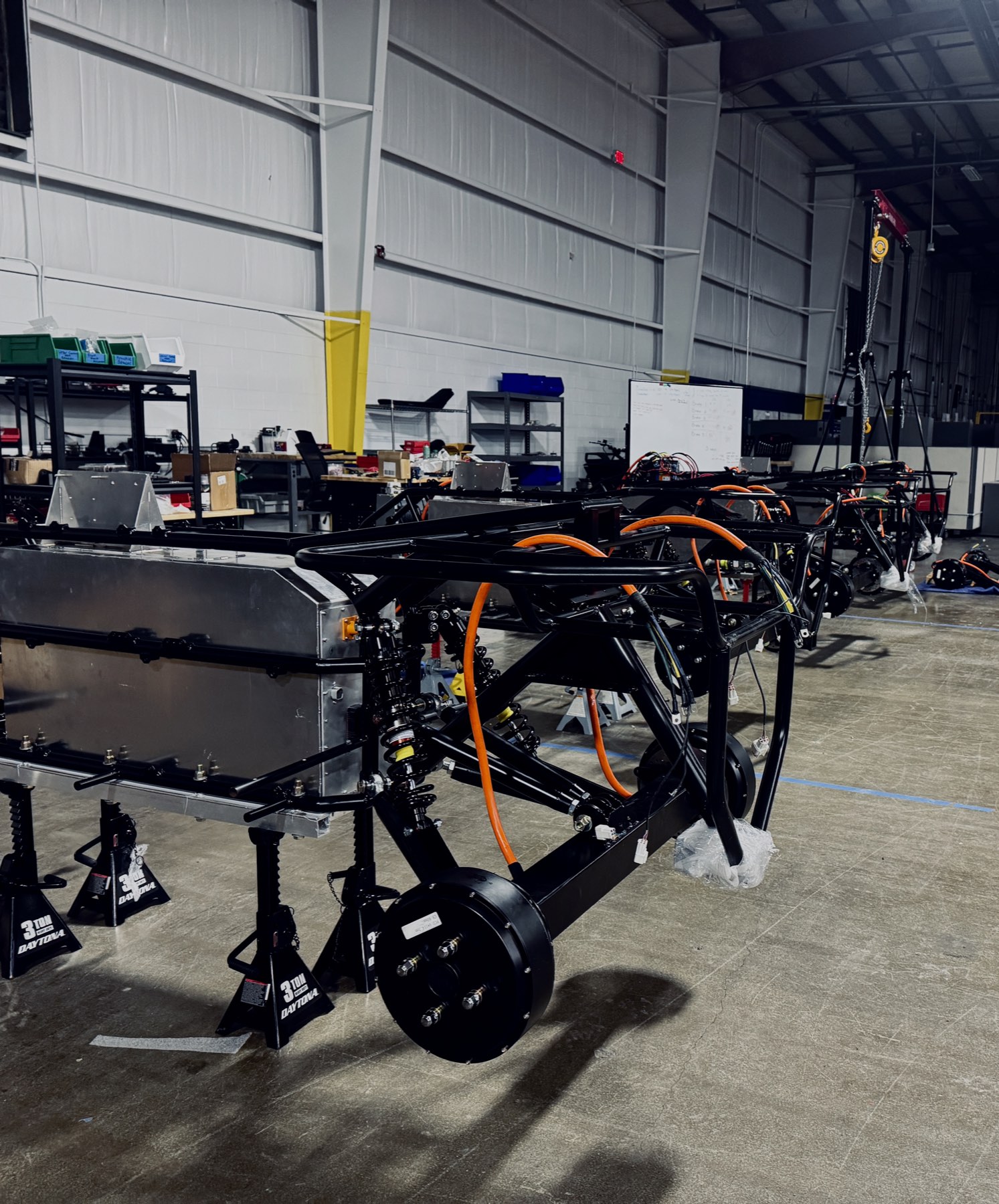 EQUAD chassis and battery packs on the assembly floor